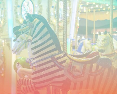Outdoor vintage flying horse carousel in the city の写真素材
