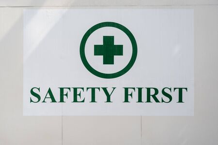 Safety frist sign instructions on a building の写真素材