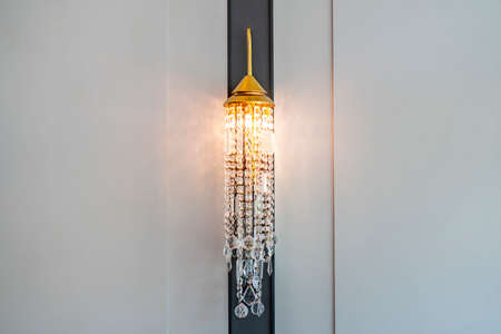 Lighted classic sconce on the wallの写真素材