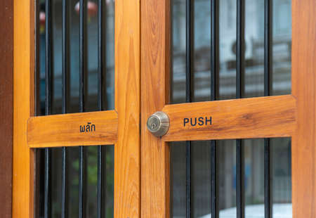 Restaurant door handle with push sign on glass doorsの写真素材