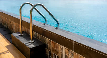 Swimming pool with stair and wooden deckの写真素材