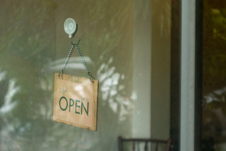 open sign hanging outside a restaurant, store, office or other