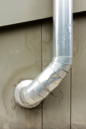 Air passage tube on building wallの写真素材