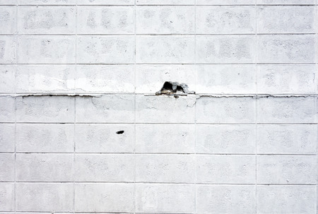 Grunge,Crack Brick block wall in white paint textureの写真素材