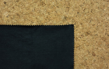 Black fabric with zig zag edge on cork board,backgroundの写真素材