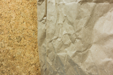 Brown Wrinkled paper on cork board-use as backgroundの写真素材