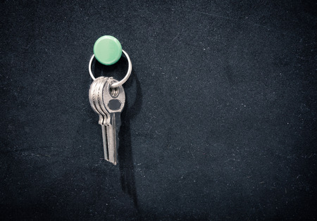Keys pin on black rubber board.の写真素材