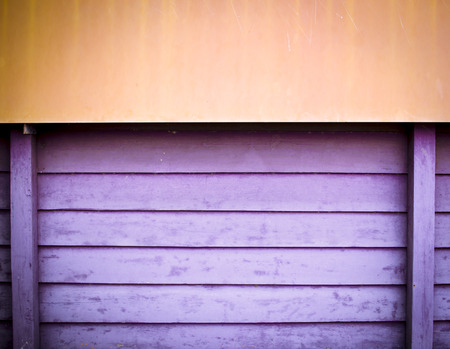 yellow and violet wooden plate wall background-grunge paint textureの写真素材