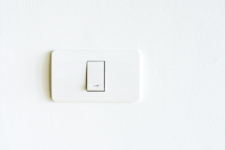 Lighting switch on white wall,modern light switch