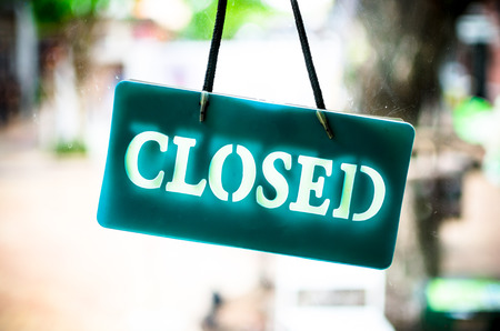 Close sign hanging on glass of shop.の写真素材