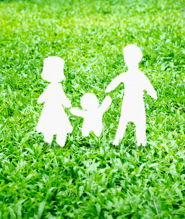 Paper Family icon on green grass.の写真素材