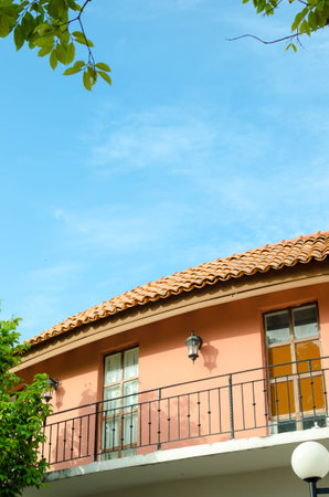 balcony Italian style house with blue nice sky and green leaf.のeditorial素材