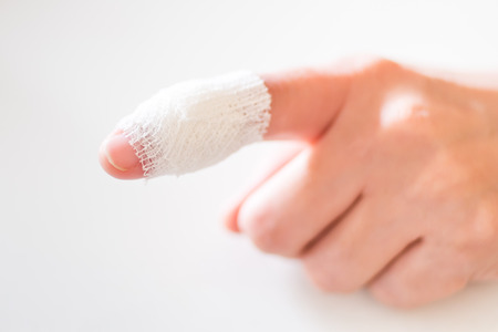 Pain finger with gauzeの写真素材