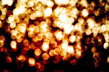 Blurred abstract background,Gold Bokeh light , sparkling theme.の写真素材
