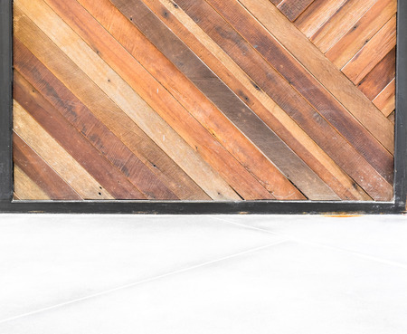 empty room interior,Grunge diagonal wood plank wall and concrete floor.