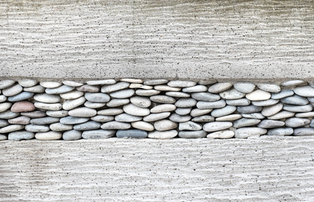 Wall layer with pebbles stone and cement,Texture background.の写真素材