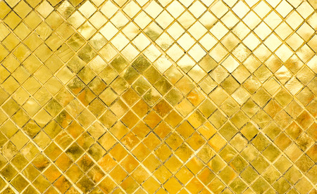 Glossy Gold mosaic tile wall, texture background.の写真素材