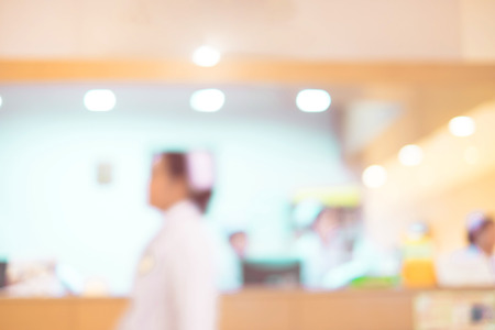 Blurred background : Vintage filter nurse at hospital counter.の写真素材
