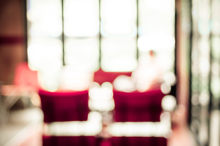 Blurred Woman reading newspaper in garden of Coffee shop with bokeh.の写真素材