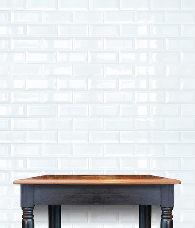vintage wood table at brick tiles wall,Template mock up for display productの写真素材