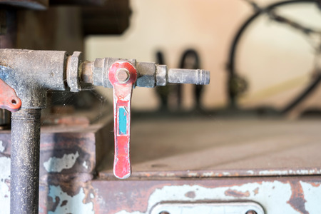 Industrial tap valve setting of old rustic machine.の写真素材