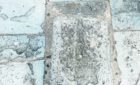 Perspective old rough pavement stone grunge texture background..