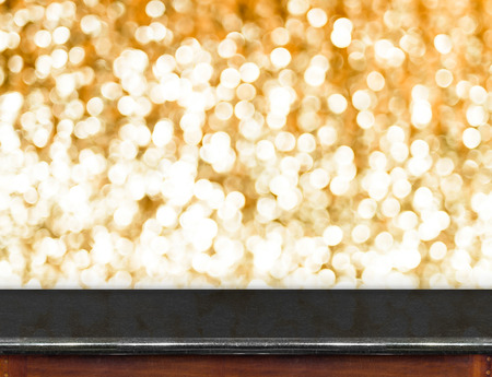 marble Table with bokeh golden sparkling background,Empty room for display your product.の写真素材