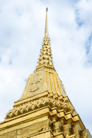 Looking up at gold pagoda Temple of the Emerald Buddha,Grand palace,Bangkok,Thailand.のeditorial素材