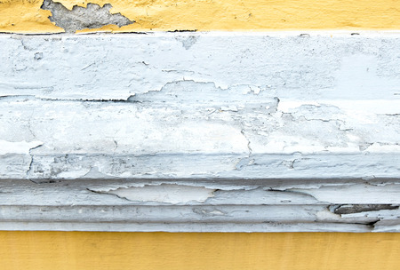 cracked yellow paint color concrete wall,texture background.の写真素材