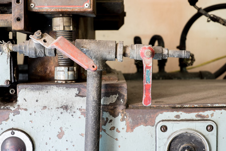 Industrial tap valve setting of old rustic machine.の写真素材