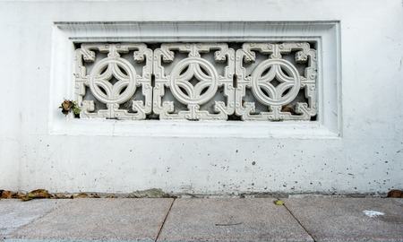 Close up at ornament ceramic decoration block at concrete wall,texture backgroundの写真素材