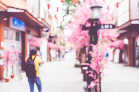Blurred background  people shopping at market fair in sunny day, blur background with bokeh.の写真素材