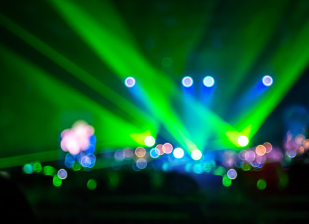 Blurred background : Bokeh lighting in concert with audience ,Music showbiz concept.