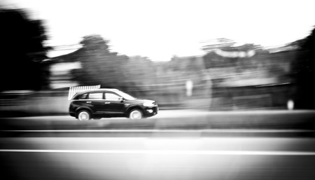 Motion blur background : car running on road ,blurred backgroundの写真素材