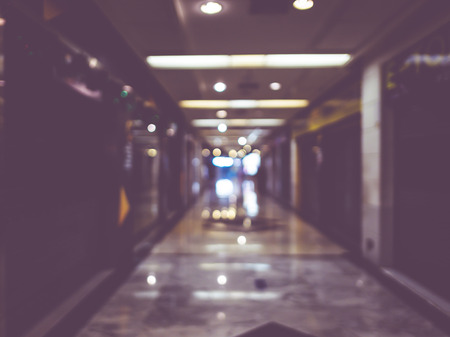 Blur background,Hallway of department store with bokeh light background,vintage filter.の写真素材
