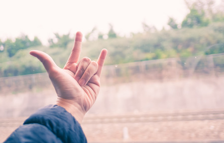 Love hand sign at train window, Love travel concept,Vintage filterの写真素材