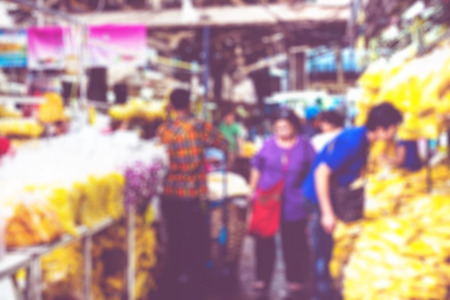 Blurred background : people shopping at flower market fair, blur background with bokeh.の写真素材