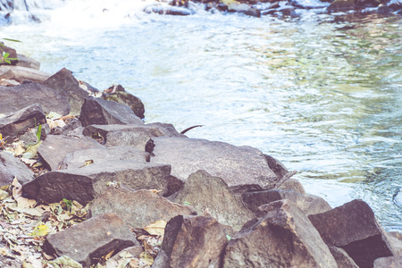Vintage filter, Group of rock at waterfall.の写真素材