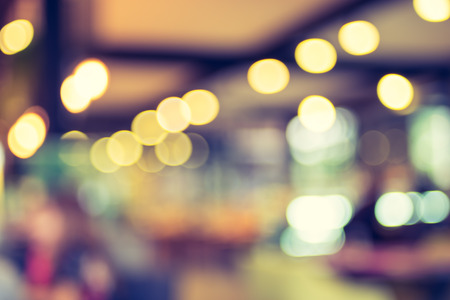 Blurred background : Customer at cafe blur background with bokeh light, Vintage filter.