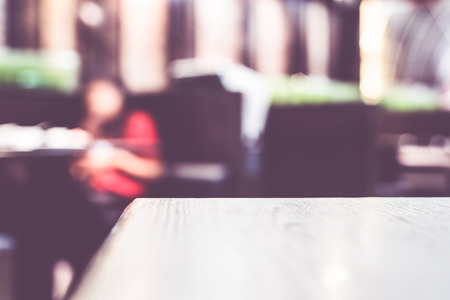 Blur background,Empty wood table at restaurant,Mock up for display of product.の写真素材