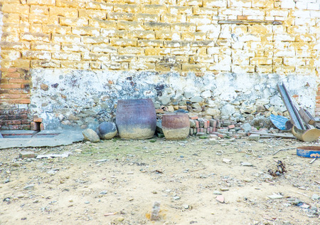 stone wall outside house,abandoned land.の写真素材