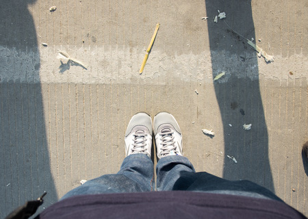 Aerial view of shoe stand on dirty road in evening sun light.の写真素材