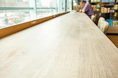 Empty wood table and blurred cafe light background. product display template.Business presentation