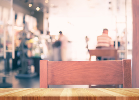 Empty wood table with blur coffee shop background,Mock up Template for display of product.の写真素材