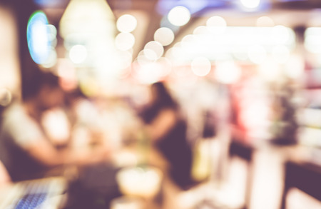 Blurred background : Vintage filter ,Customer in Coffee shop blur background with bokeh.の写真素材