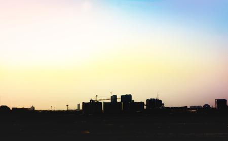 silhouette of city scape with dreamy color sky,leave space for adding your content.の写真素材