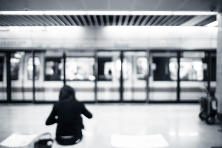 Blurred background, people waiting train at subway station with bokeh.の写真素材