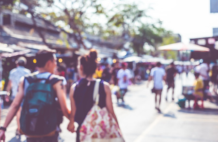 Blurred background : people shopping at market fair in sunny day, blur background with bokeh.の写真素材