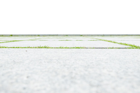 low angle view of concrete floor with green grass isolated on white background.の写真素材