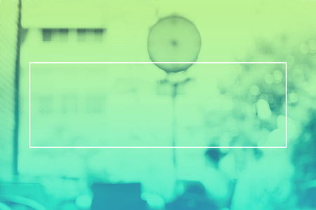 Empty white frame on gradient greenDuotone of blur woman reading book in cafe background, Mock up for adding your text.の写真素材